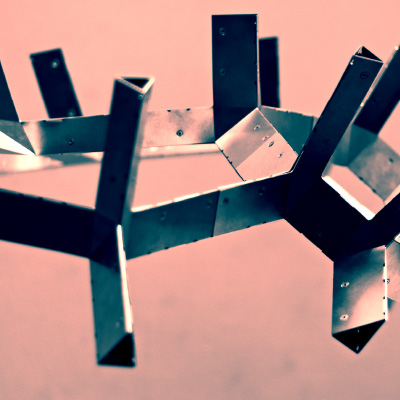 A close-up photo of interconnected caltrop-shaped metal project.