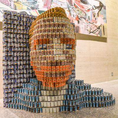 A large head of Vincent Van Gogh made out of canned food project.