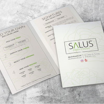 A food menu placed on a marble surface project.